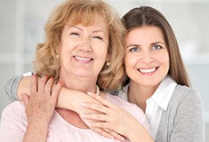 Two women smiling together