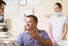 Smiling man in dental chair