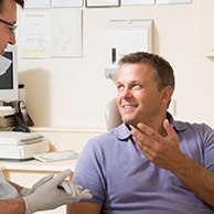 Man talking to his dentist