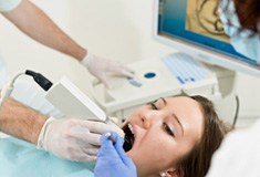 Patient undergoing dental scan in preparation for CEREC crown