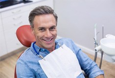 ClHappy male patient at appointment for same-day crowng