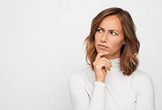 a woman thinking and looking off into the distance