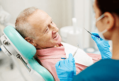 a patient getting his tooth replacements checked