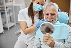 An older man enjoying his dental implants