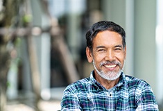 Man smiling with dental implants in Forest