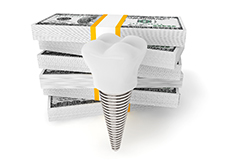 implant and money representing the cost of dental implants in Forest