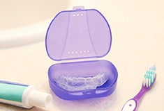 A close-up of aligners on bathroom counter