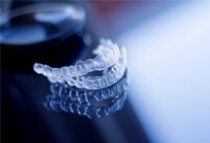 Invisalign aligners sitting on a counter