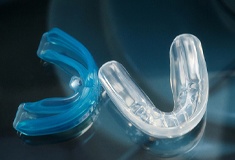 Closeup of blue and clear nightguards.