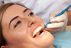 Woman receiving dental exam