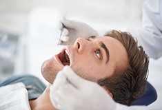 Man getting oral cancer screening