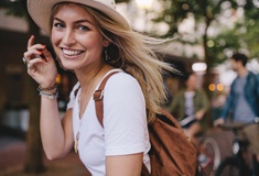 person smiling and walking