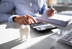 patient calculating cost of veneers in Forest