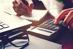 Woman using a calculator