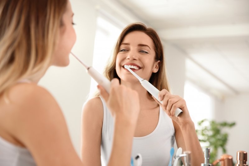 Woman brushing teeth