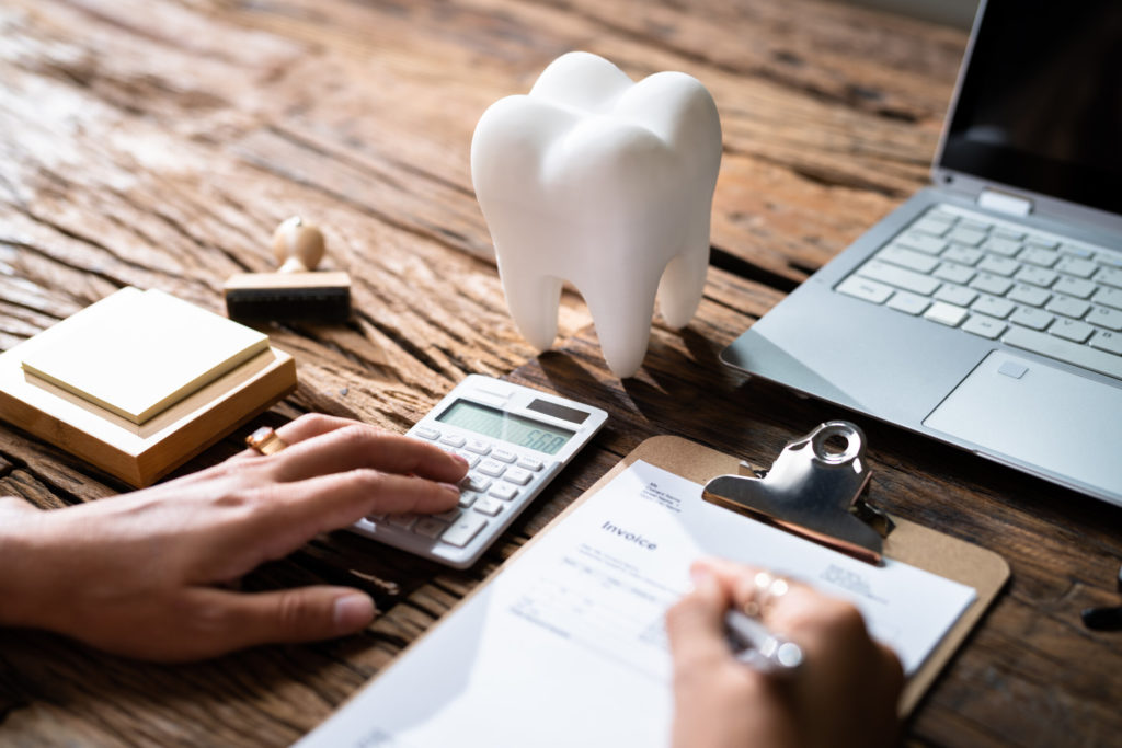 person deciding how to maximize dental insurance benefits in Forest