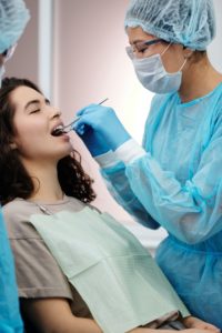Woman in dental chair with full mouth reconstruction 