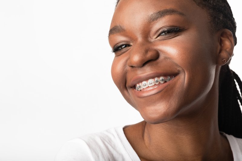 smiling woman with braces